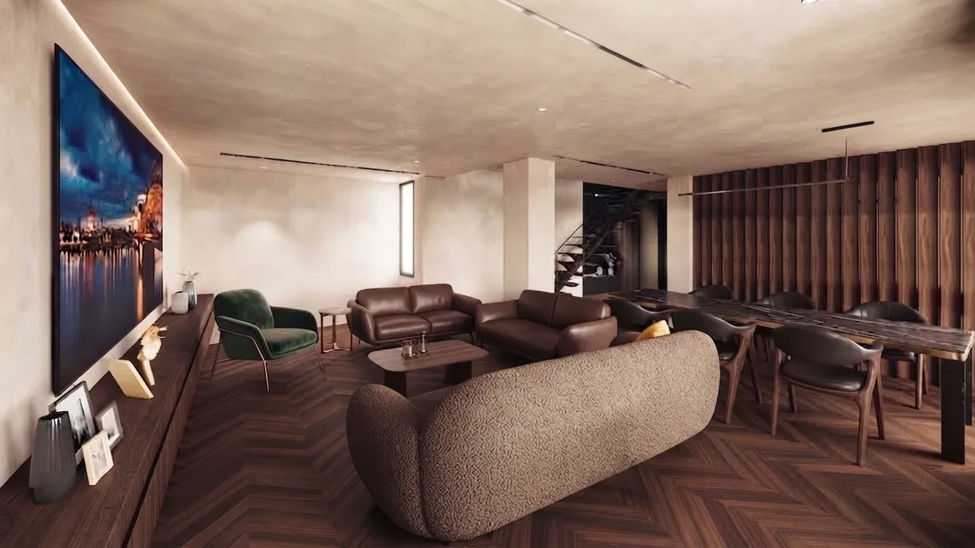 Séjour du duplex avec canapé bouclé, fauteuil vert, table en pierre et lames de bois au mur