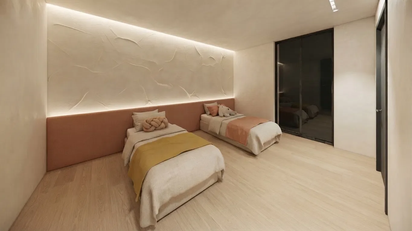 Chambre d'enfants du duplex avec deux lits, tête de lit en velours rose et chêne clair